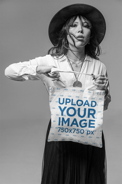Monochromatic Mockup of a Stylish Woman Holding a Tote Bag with Both Hands