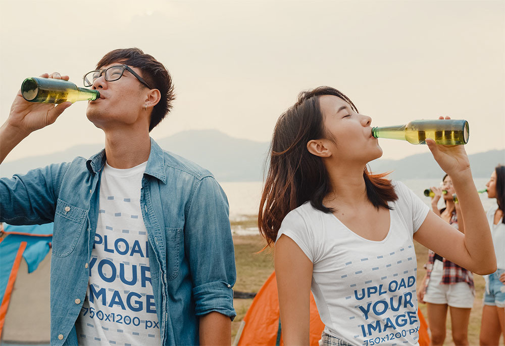 T-Shirt Mockup Featuring Two Friends Drinking Beer by a Lake