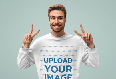 Sweatshirt Mockup Featuring a Happy Man Making Peace Sign with His Hands