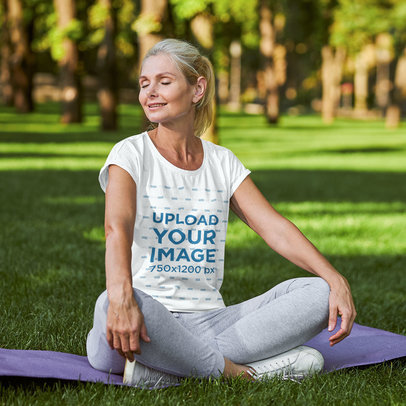 Round-Neck Tee Mockup of a Smiling Woman Sitting on a Gym Mat at a Park m11670-r-el2