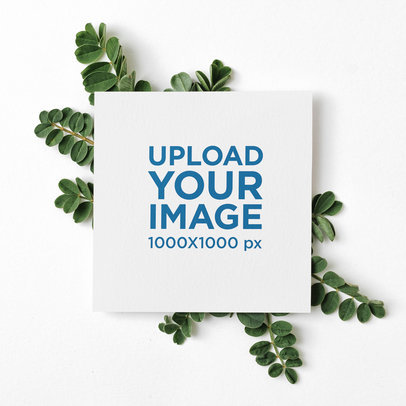 Mockup of a Square Wedding Program Featuring Some Leaves as an Ornament