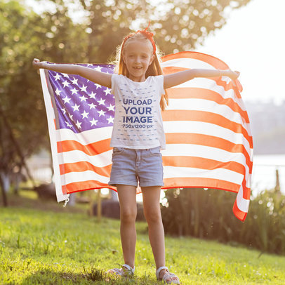 T-Shirt Mockup of a Girl Standing by a River and Holding an American Flag Behind Her Back m26237-r-el2