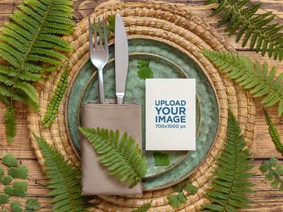 Wedding Program Mockup Featuring a Wooden Table and a Cutlery Set m25016 r-el2