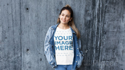 Beautiful Woman Wearing a Denim Jacket and a Tshirt Stop Motion Against a Concrete Wall