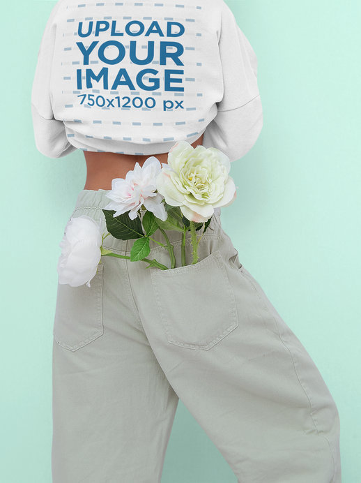 Back-View Sweatshirt Mockup of a Woman with Flowers in Her Pants Pocket