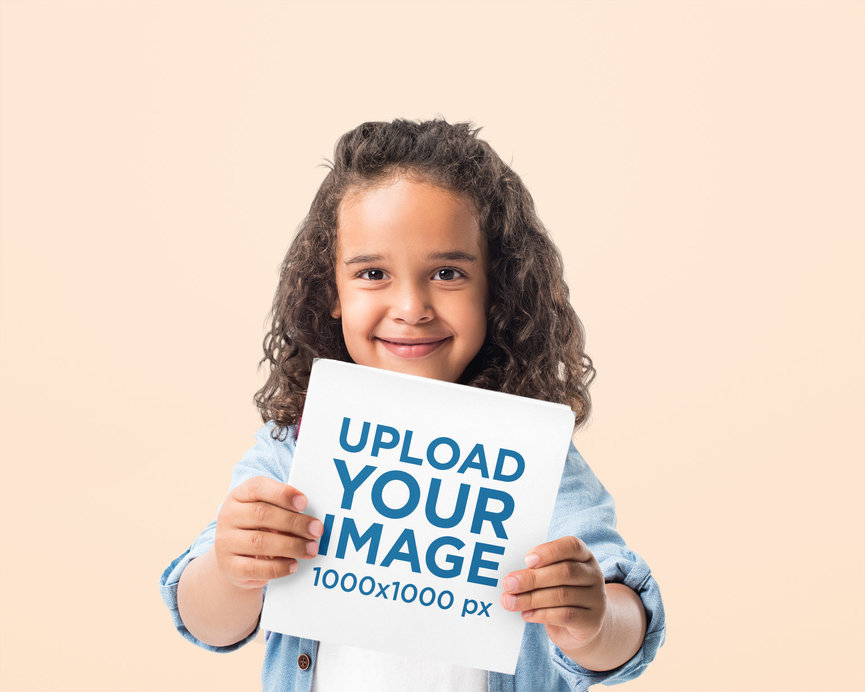 Mockup of a Happy Little Girl Holding a Square Book