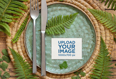 Wedding Program Mockup Featuring a Table Setting With Fern Leaves