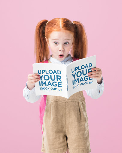 Book Mockup Featuring a Surprised Redhead Little Girl