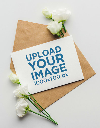 Wedding Invite Mockup Featuring an Envelope and Flowers
