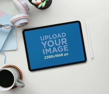 Mockup of an iPad Placed Next to a Digital Pencil m17505 r-el2