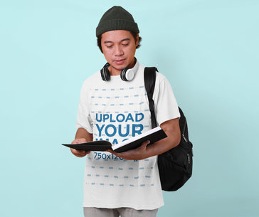 T-Shirt Mockup of a Man with a Student-Inspired Outfit at a Studio