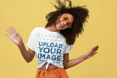 Knotted T-Shirt Mockup Featuring a Happy Curly-Haired Woman in a Summer Outfit