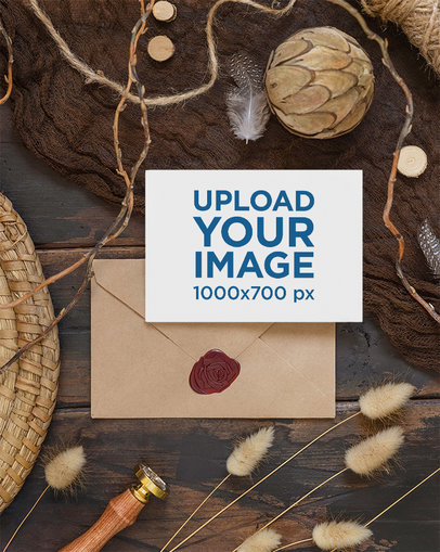 Mockup of a Wedding Program Placed on a Wooden Table With Some Dried Plants