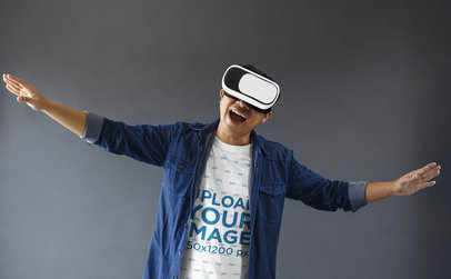 T-Shirt Mockup of a Joyful Man Wearing a Virtual Reality Headset