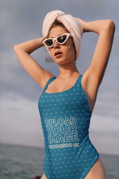 Swimsuit Mockup Featuring a Woman with Sunglasses and a Towel Wrapped Around Her Head