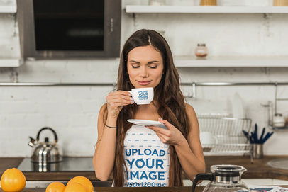 Tank Top Mockup Featuring a Woman Smelling her Coffee From Her Mug