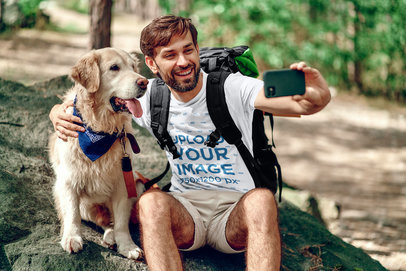 Tee Mockup of a Happy Hiker Taking a Selfie with His Dog