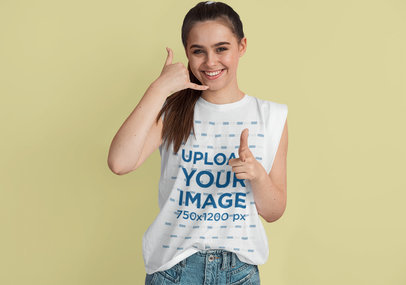 Sleeveless Tee Mockup Featuring a Happy Young Woman Doing the Call Me Sign