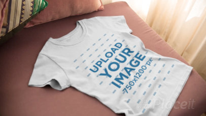 Video Closeup of a Round Neck T-Shirt Spread Over a Sofa