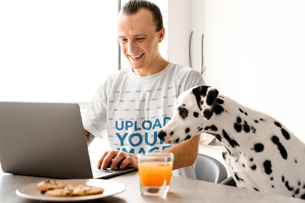 Round-Neck Tee Mockup of a Man Working at Home with His Dalmatian