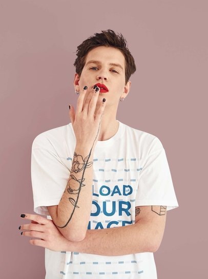 T-Shirt Mockup Featuring a Man with Red Lips and an Arm Tattoo