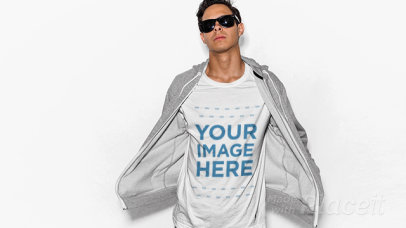 Young Man Wearing a T-Shirt and a Full Zip Hoodie in Stop Motion with His Sunglasses On