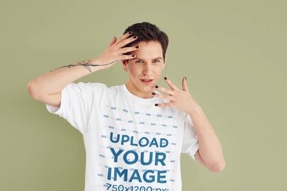 T-Shirt Mockup of a Man Posing with His Hands near His Face