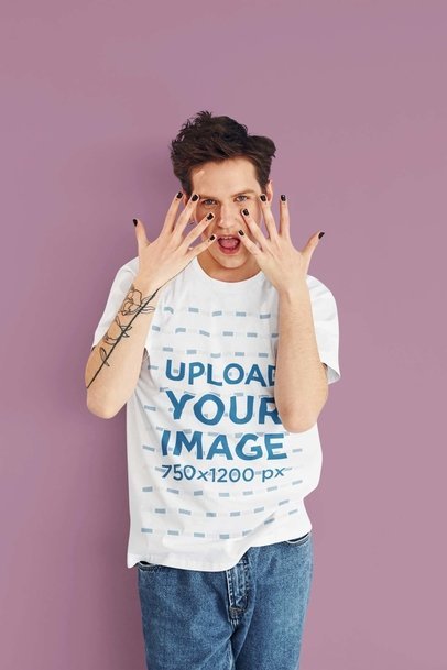 T-Shirt Mockup of a Man with an Arm Tattoo and Dark Nail Polish