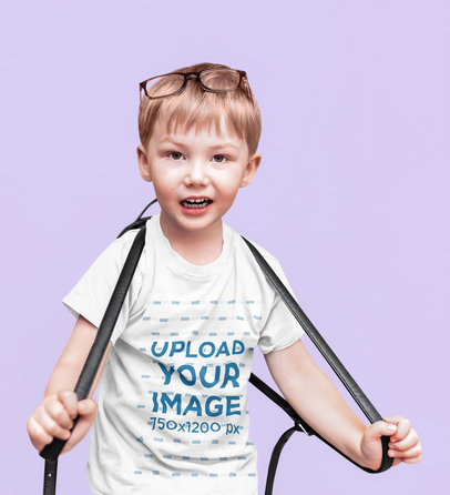T-Shirt Mockup Featuring a Confused Kid at a Studio