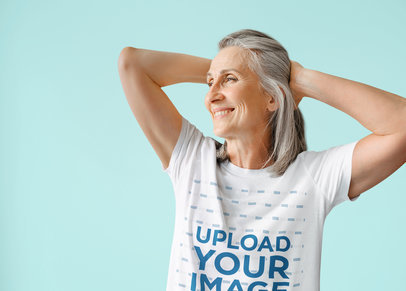 T-Shirt Mockup of a Senior Woman Smiling and Posing With Her Hands on Her Head m25811 r-el2