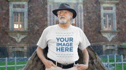 Senior Man Wearing a Hat and a Round Neck Tee Video Talking to Someone