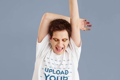 T-Shirt Mockup Featuring a Happy Man with Colorful Eye Makeup