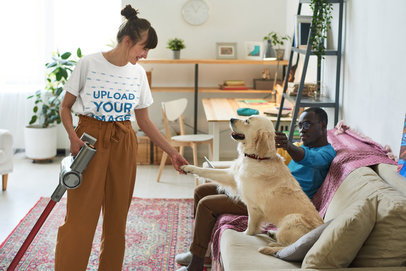 T-Shirt Mockup of a Woman Holding a Dog's Paw