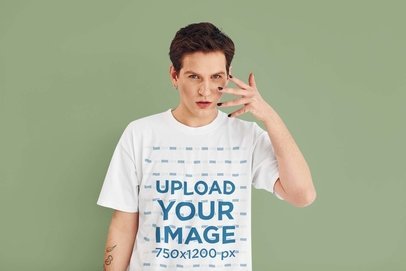 T-Shirt Mockup Featuring a Tattooed Man With Black Nail Polish