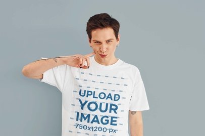 Round-Neck Tee Mockup of a Man with Nail Polish and an Arm Tattoo
