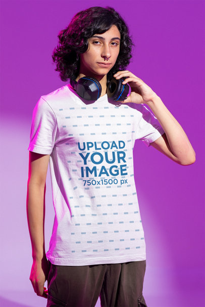 Bella Canvas Tee Mockup of a Man Wearing Headphones at a Studio