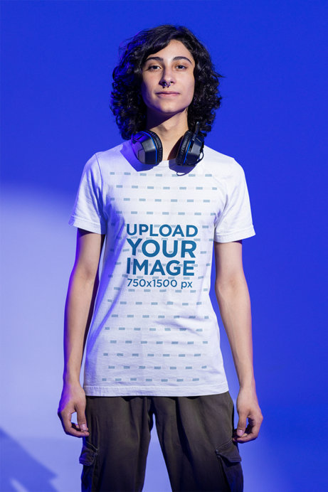Mockup of a Man Wearing a Bella Canvas Tee and Headsets Around His Neck