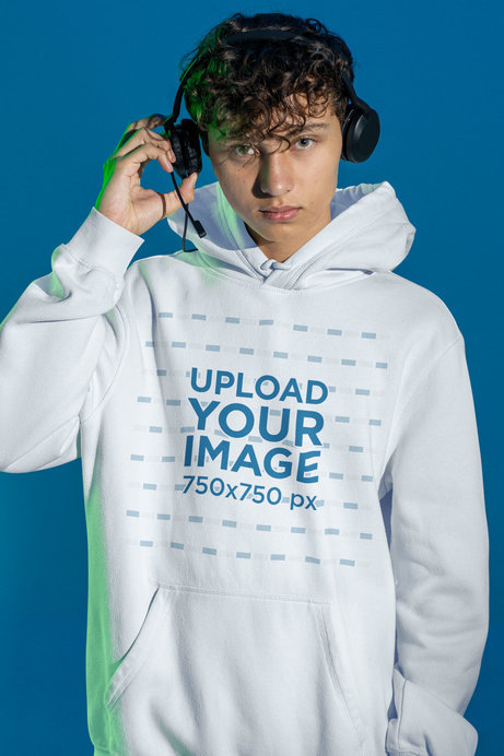 Mockup of a Gamer Wearing a Hoodie and Headphones