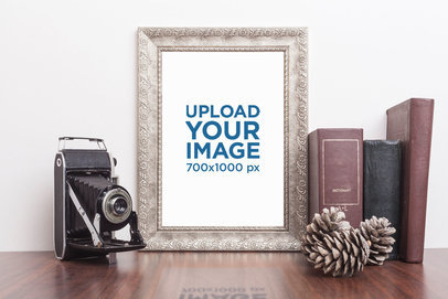 Mockup of a Framed Art Print Featuring a Vintage Camera