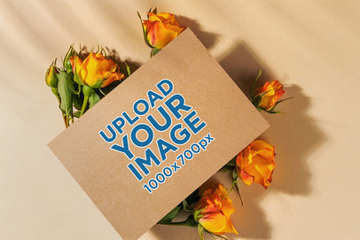 Mockup of a Wedding Program Placed on Top of Some Flowers