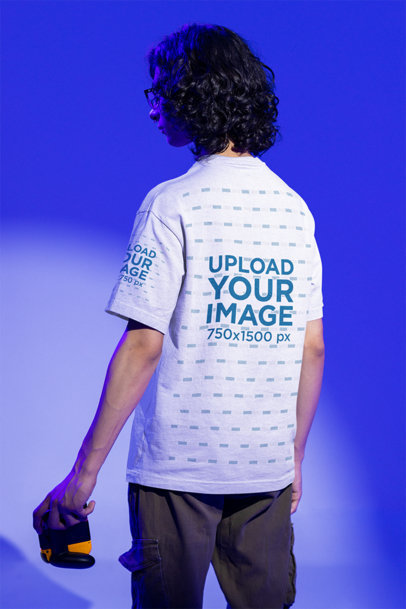 Back-View Mockup of a Man Posing at a Studio While Wearing a Tee m28495