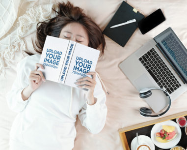 Book Mockup Featuring a Woman Sleeping and Covering Half Her Face m27907 r-el2