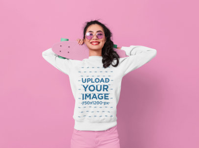 Sweatshirt Mockup of a Happy Woman Holding a Skateboard