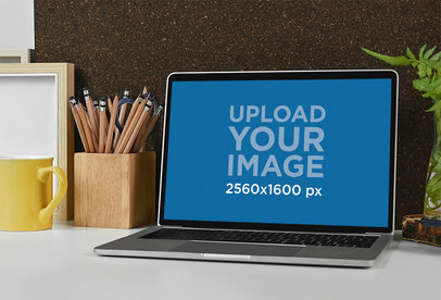 Mockup Featuring a MacBook Pro Placed on a Teacher’s Desk