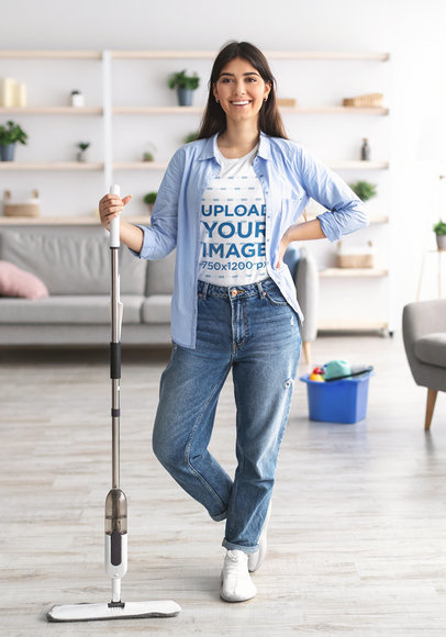 Round-Neck Tee Mockup of a Happy Woman Cleaning Her Living Room
