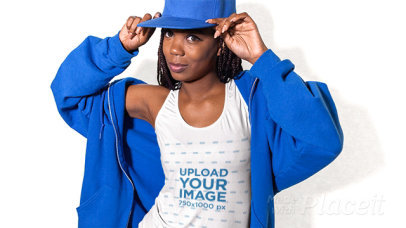 Beautiful Woman Wearing a Hoodie and a Scoop Neck Tank Top  Stop Motion Posing in a Studio a13373