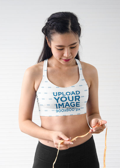 Sports Bra Mockup of a Woman Checking a Tailors Tape m21608 r-el2