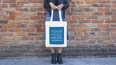 Woman Holding a Tote Bag Stop Motion Wearing Boots and a Dress