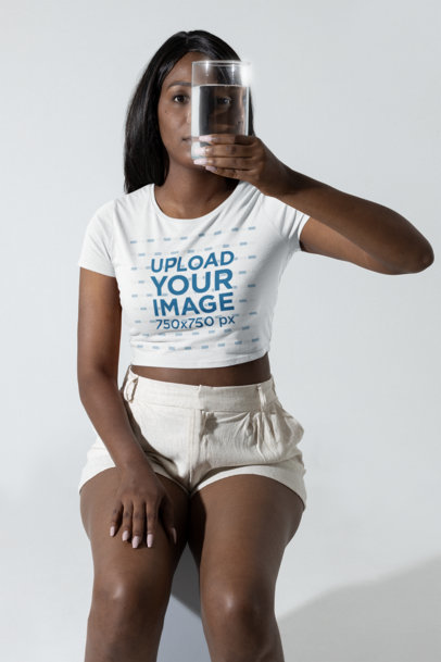 Crop Top Mockup of a Woman Looking Through a Glass of Water m28403