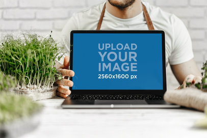 Mockup of a Gardener Displaying a MacBook m16024 r-el2